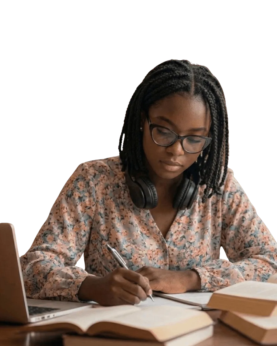 A Nigerian student studying with a laptop